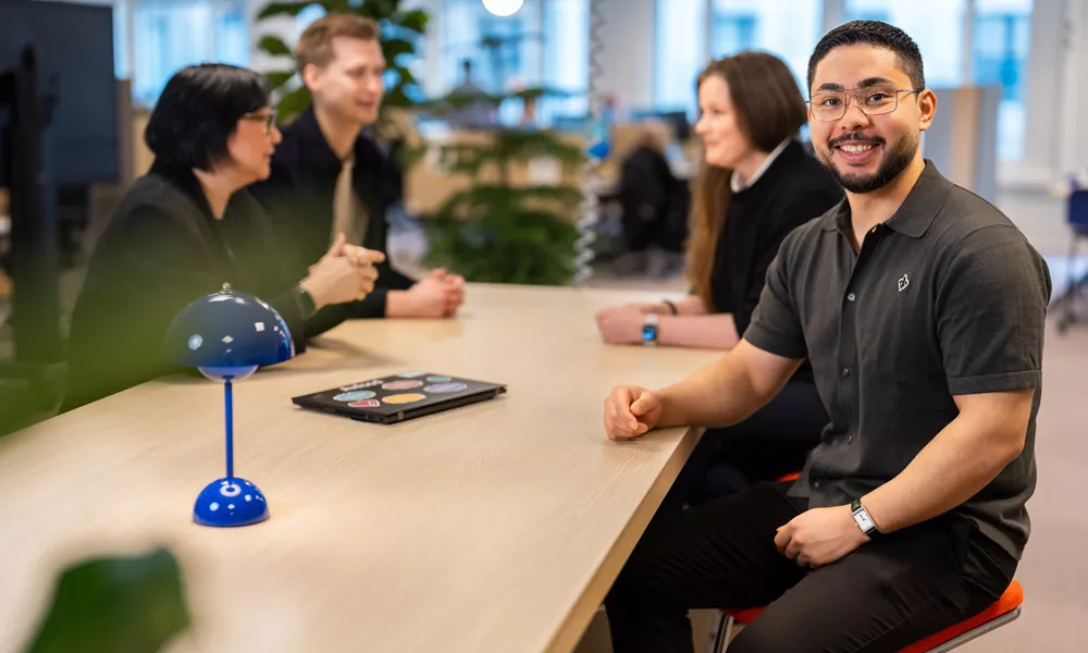 Male employee looking into the camera smiling