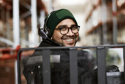 Female customer talking to employee in food store